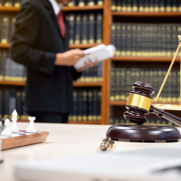 Detail of a judge sitting at his desk.