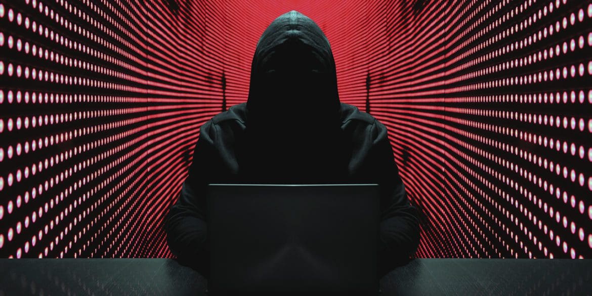 Anonymous hacker in front of his computer. | iStock photo