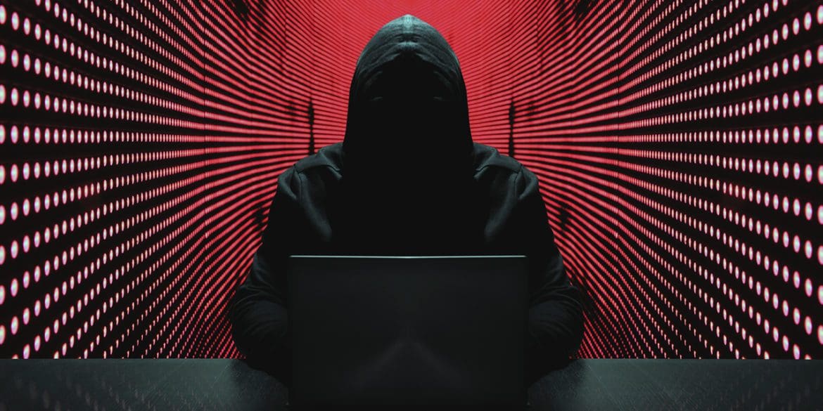 Anonymous hacker in front of his computer. | iStock photo