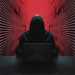 Anonymous hacker in front of his computer. | iStock photo