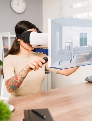 Young woman using a VR headset and joystick. | Antonio Diaz photo