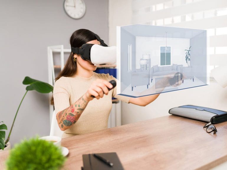 Young woman using a VR headset and joystick. | Antonio Diaz photo