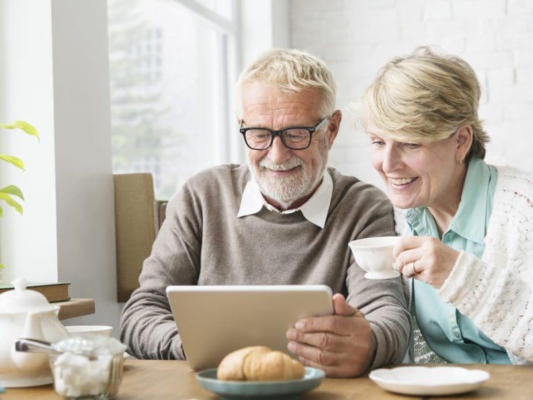 Senior Adult Using Digital Device Tablet Concept