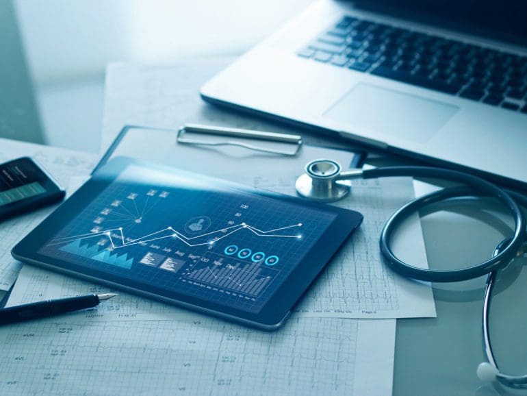 Healthcare business concept, Medical examination and growth graph data of business on tablet with doctor's health report clipboard on background.