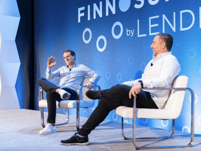 Steve McLaughlin of FT Partners shares a laugh with Paulo Passoni of Softbank