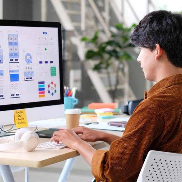 Website designer, Creative planning phone app development template layout framework wireframe design, User experience concept, Young asian man UX designer working on smartphone application at office