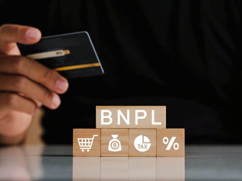 Man's hands holding credit card with BNPL icons. Buy now pay later online shopping concept. Online shopping icons.