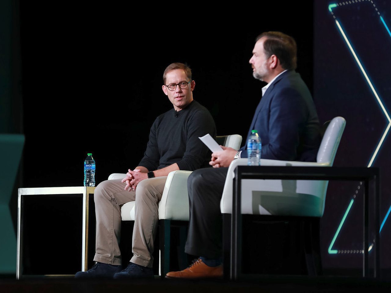 Chris Britt (left) was a keynote speaker at Fintech Nexus 2022. He was interviewed by Paul Stamas from General Atlantic