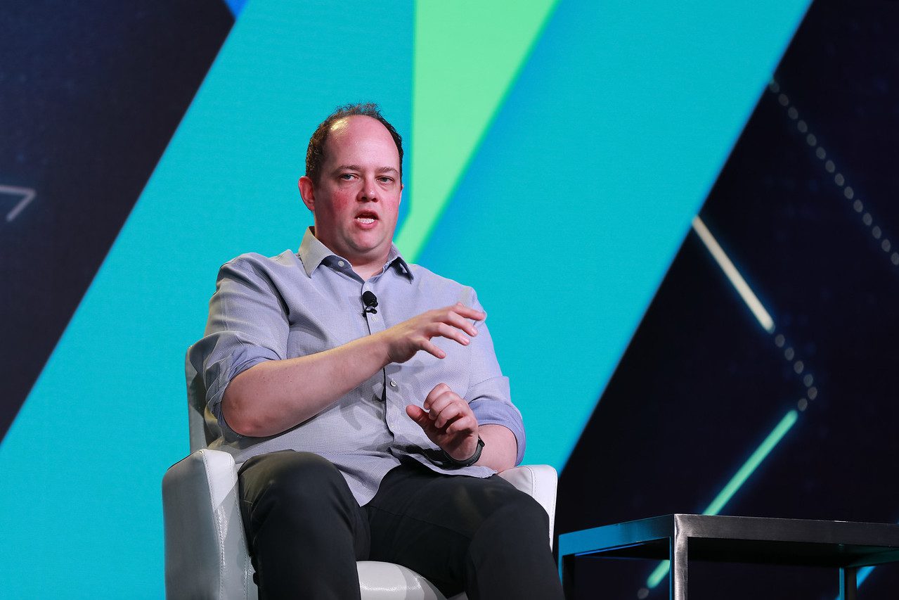 Sarah Clark, SVP of Digital Identity at Matercard (left), Ahron Geminder (midle right), global head of product for 3rd party services at HSBC, and Mike Tuchen (center left), CEO at Onfido, sat down with moderator Bo Brusktern on the Fintech Nexus USA keynote stage in NYC on May 25th 2022. How can Financial services become like Amazon?