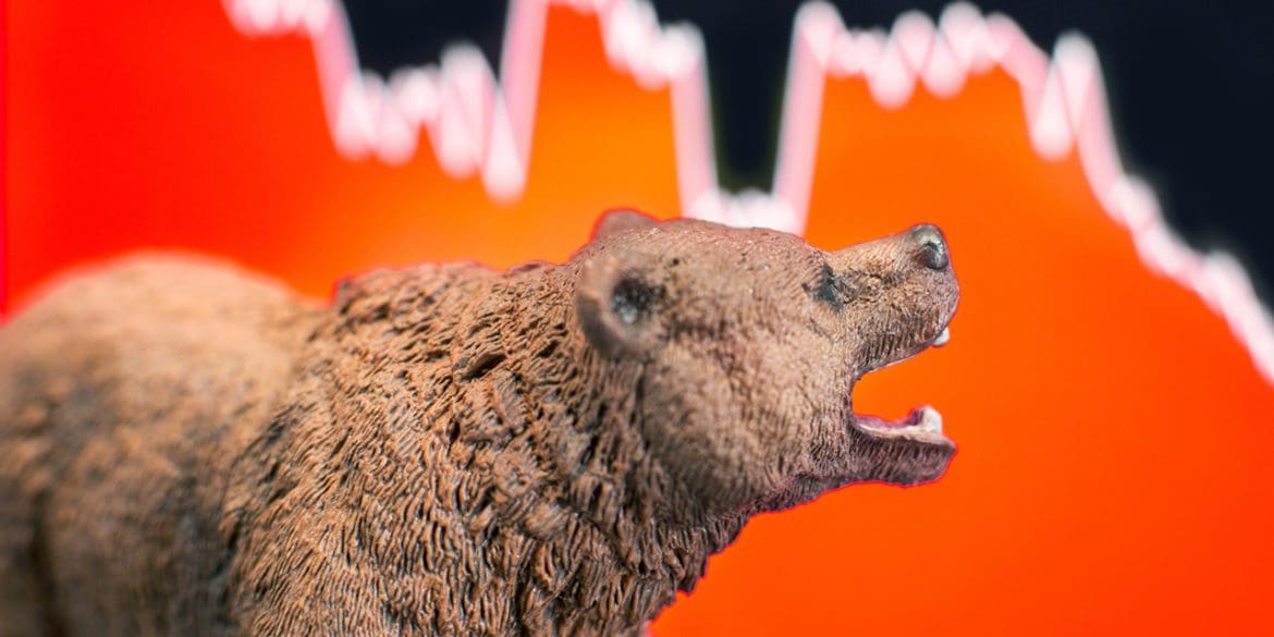 Bearish scenario in stock market with bear figure in front of red price drop chart.