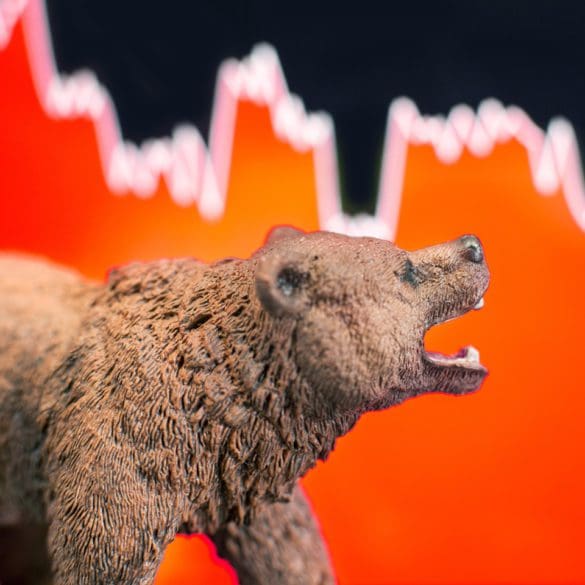 Bearish scenario in stock market with bear figure in front of red price drop chart.