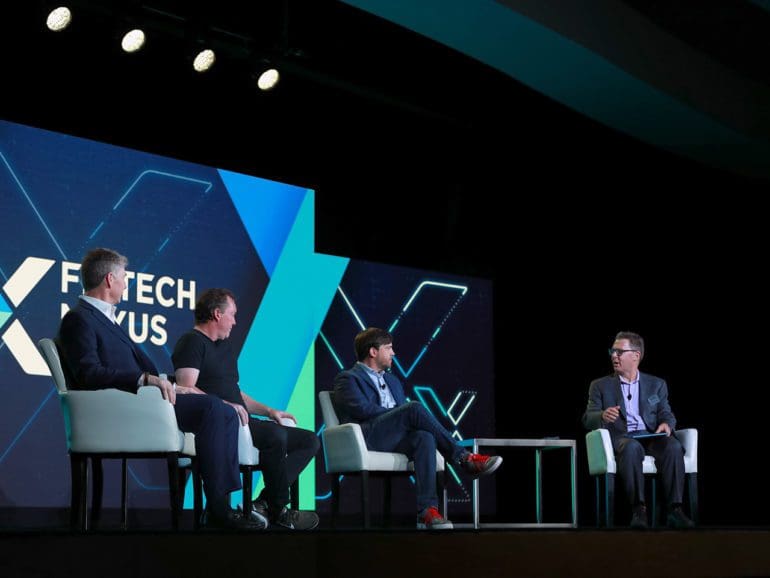 During a fireside chat, Co-founder and CEO of Figure Mike Cagney(center Left) Wade Peery, CAO of FirstBank, (Left) and Matthew Maxey, Head of innovation at Synovus bank (Center Right), sat down with Peter Renton to discuss the future of stablecoin payments on the Fintech Nexus Keynote stage on May 26th, 2022 in New York City.