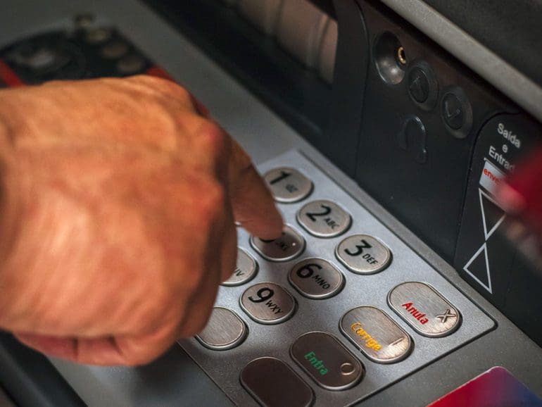 hand using ATM