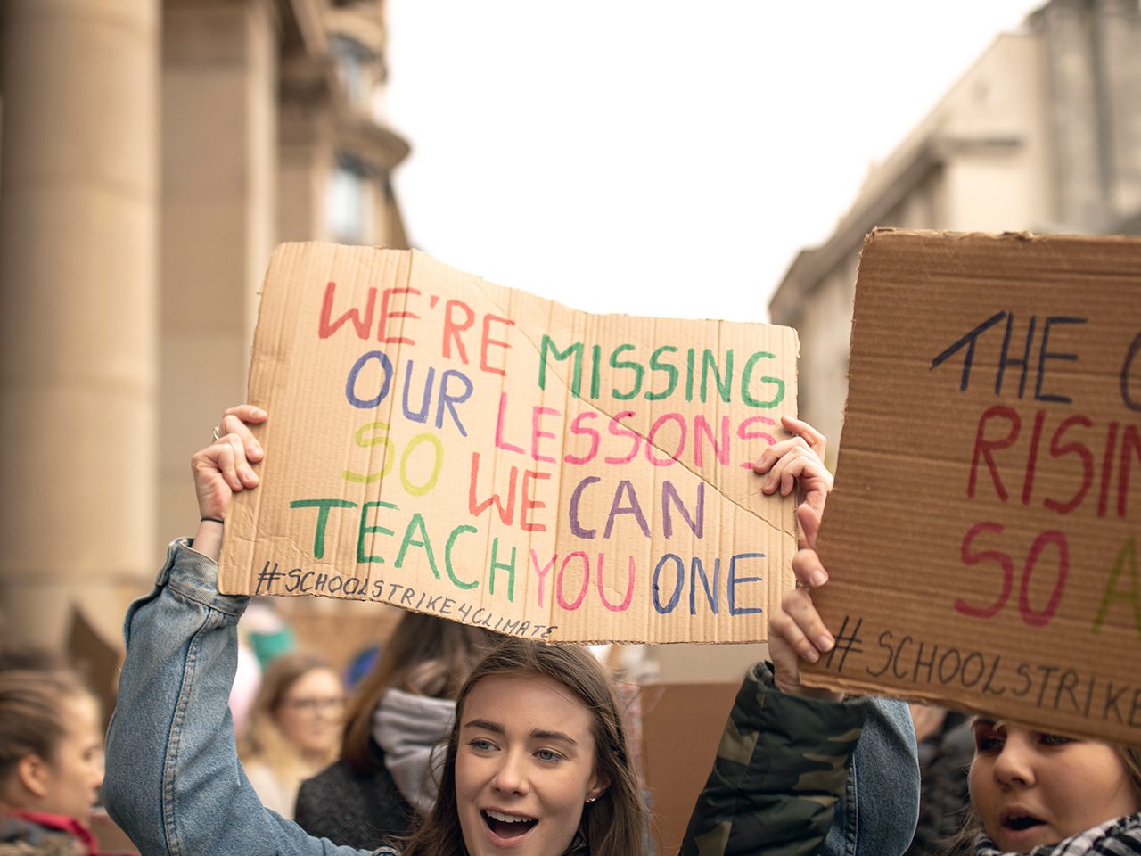 Woman holding protest sign