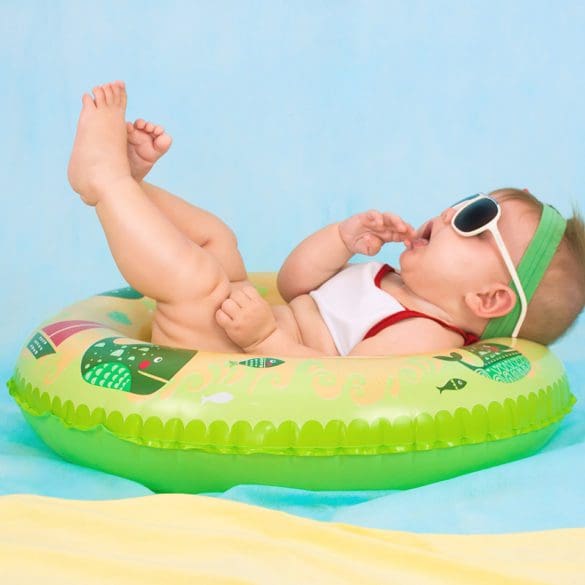 baby in floaty in water