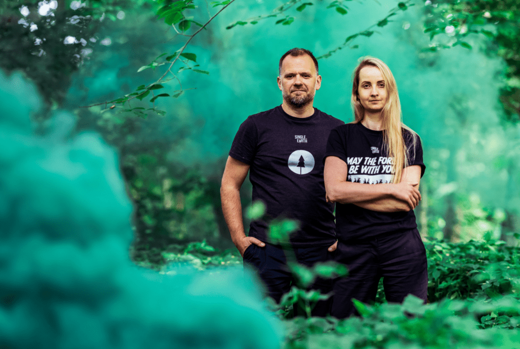 man and women in forest 