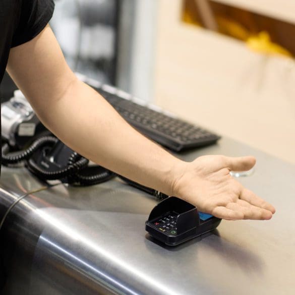 hand touching payment machine