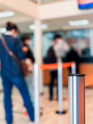 row of people to the bank teller cashier defocused background