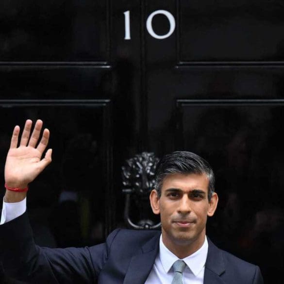 Britain's newly appointed Prime Minister Rishi Sunak waves as he poses outside to door to 10 Downing Street in central London, on October 25, 2022, after delivering his first speech as prime minister. - Rishi Sunak was on Tuesday appointed as Britain's third prime minister this year, after outgoing leader Liz Truss submitted her resignation to King Charles III. (Photo by Daniel LEAL / AFP) (Photo by DANIEL LEAL/AFP via Getty Images)