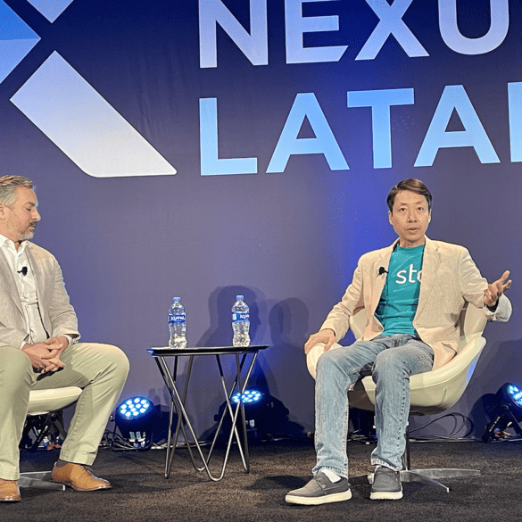 Moderator Jacob Haar, CIM, chats with Bin Chen, Stori, on the Scaling Financial Inclusion Sustainably keynote on the main stage.