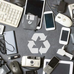 Old electronic devices on a dark background. The concept of recycling and disposal of electronic waste