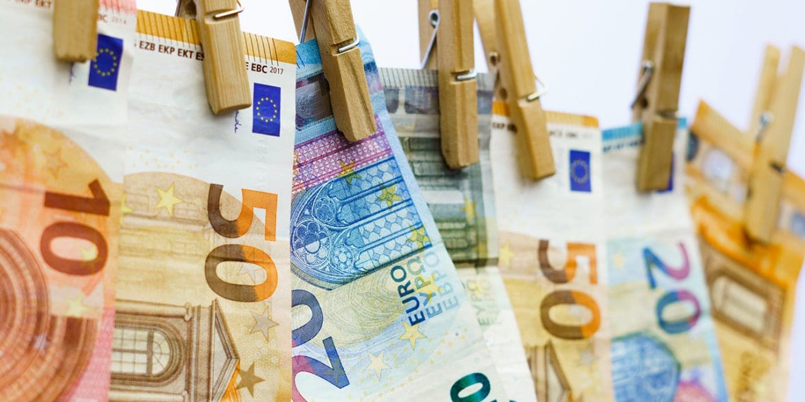 euro banknotes hung on a clothesline with clothespins in Málaga, Andalusia, Spain