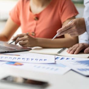 Business accountants are coaching laptop-based apprentices on tax systems, financial accounting and budget management.