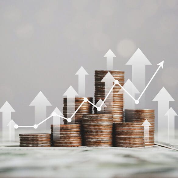 stack of silver coins with trading chart in financial concepts and financial investment business stock growth