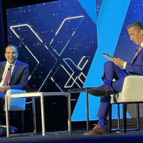 Phil Goldfeder, CEO of American Fintech Council, right, interviews Rohit Chopra, Director, Consumer Financial Protection Bureau, on the keynote stage at Fintech Nexus USA 2023 at the Javits Center in New York City. | John K. White, Fintech Nexus