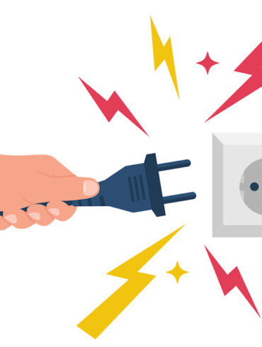 Electric power plug holding in hand. Unplug, and plugged in the wall socket. Vector illustration flat design. Connecting power plug. Sparks flying from the outlet.