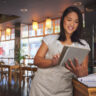 Restaurant, coffee shop and woman online on tablet